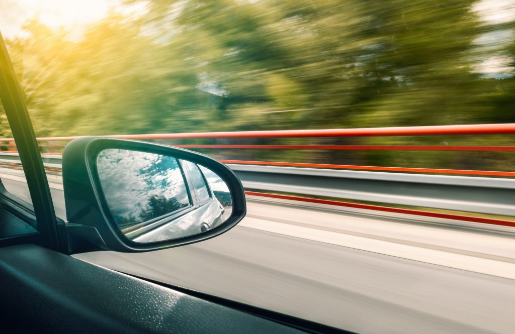 A side view mirror on a car.