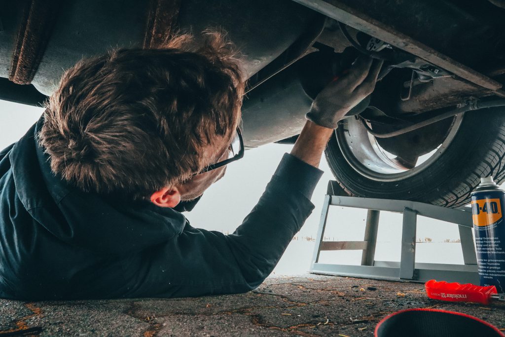 A person working under a car.